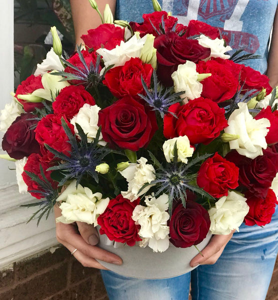 When you truly want to take their breath away, send this mesmerizing rose bouquet. Its artistic, organic design, luxurious blooms, and shimmering cube vase set it apart from the rest!