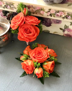 Corsage and boutonnière in orange