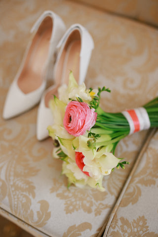 Beautiful spring bridal and prom bouquet with pink  ranunculus, freesia and stunning calla lilies.