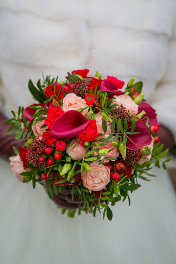 Bridal and prom bouquet with red mini roses, callas, berries.