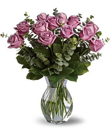 Romantic roses with a lavender twist!  Includes:  Lavender roses, assorted greens Vase Free message card