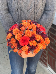 Celebrate the beauty of fall with this colorful, heartwarming mix flowers, hand-delivered in our classic box.   Includes:  Orange mini roses, purple daisies, assorted greens. Box Free message card
