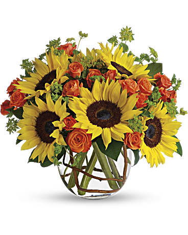 Brighten up a table, send get well wishes, or simply sprinkle sunshine on someone's day with this summer flower arrangement.  Includes:  Sunflowers, orange mini roses, assorted greens Vase Free message card
