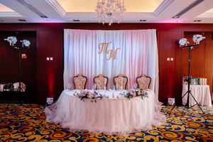 White and pink sweetheart table and backdrop