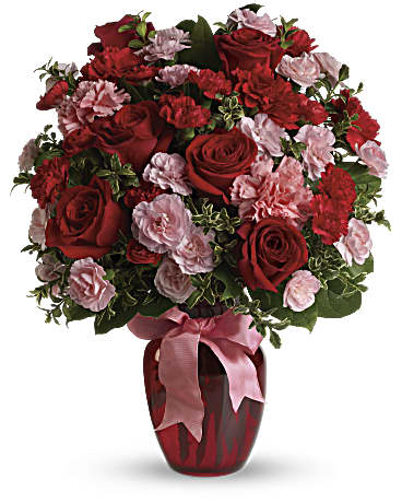 If you want to make a really big impression, surprise her with delivery to her office.   Includes:  Red roses, pink and red carnations, assorted greens. Vase Free message card