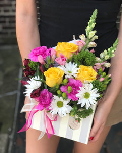 Featuring a wide, wondrous assortment of blooms in one bouquet, this colorful arrangement is always a favorite!   Includes:  Yellow roses, pink carnations, white daisies, pink snapdragons, red alstroemeria. Floral envelope Free message card