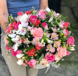 It's beauty-full! This delightful pink arrangement brings spring joy to that special someone.  Includes:  Pink roses, carnations and alstroemerias, berries, orchid. Velvet box Free message card