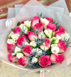 She may call this the prettiest bouquet she's ever received - for good reason!  Includes:  17 Pink roses, eringium, fern. Wrapped in a craft paper. Free message card