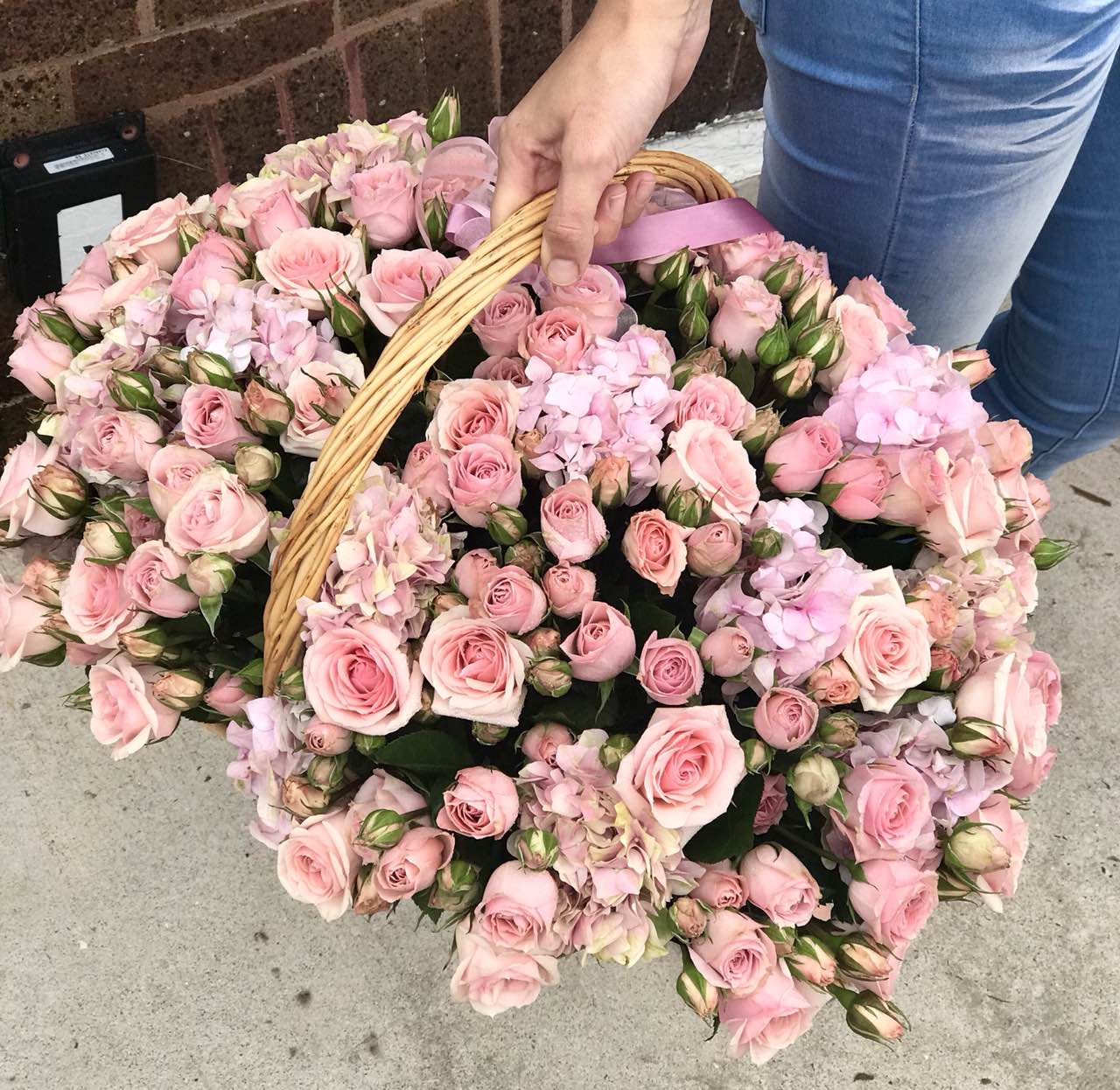 Welcome the newest little cutie into the world with this pink-tastic basket of roses and hydrangea.  Includes:  Pink mini roses, pink hydrangea. Basket Free message card