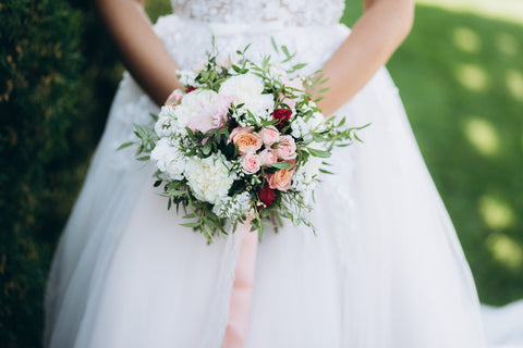 Beautiful bridal and prom bouquet with carnations, mini roses and peonies.