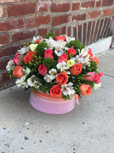 As warm and inviting as a day at the beach or summer sunrise, this invigorating arrangement of mouthwatering orange flowers is a gorgeous expression of your love or friendship.  Includes:  Orange roses, white alstroemerias, berries, assorted greens. Velvet box Free message card