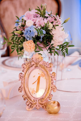 Centerpieces - whether large and spectacular or small and clustered. We love them all!  Includes:  Pink,white and light blue hydrangea, white lisianthus, creamy carnations,assorted greens. Vase